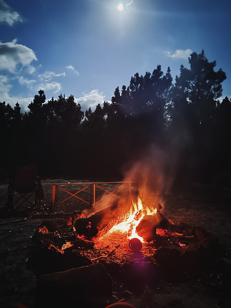 Campfire under a full moon.