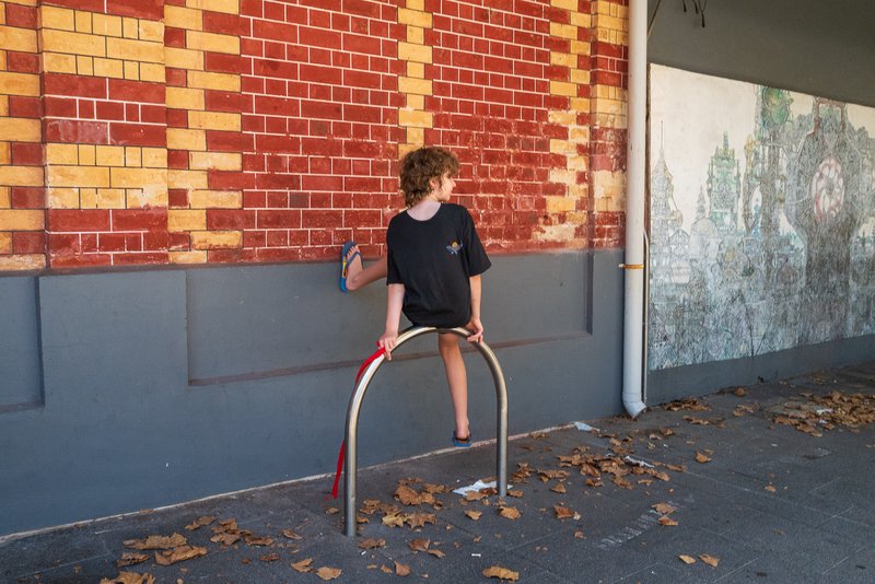Leaning against a wall